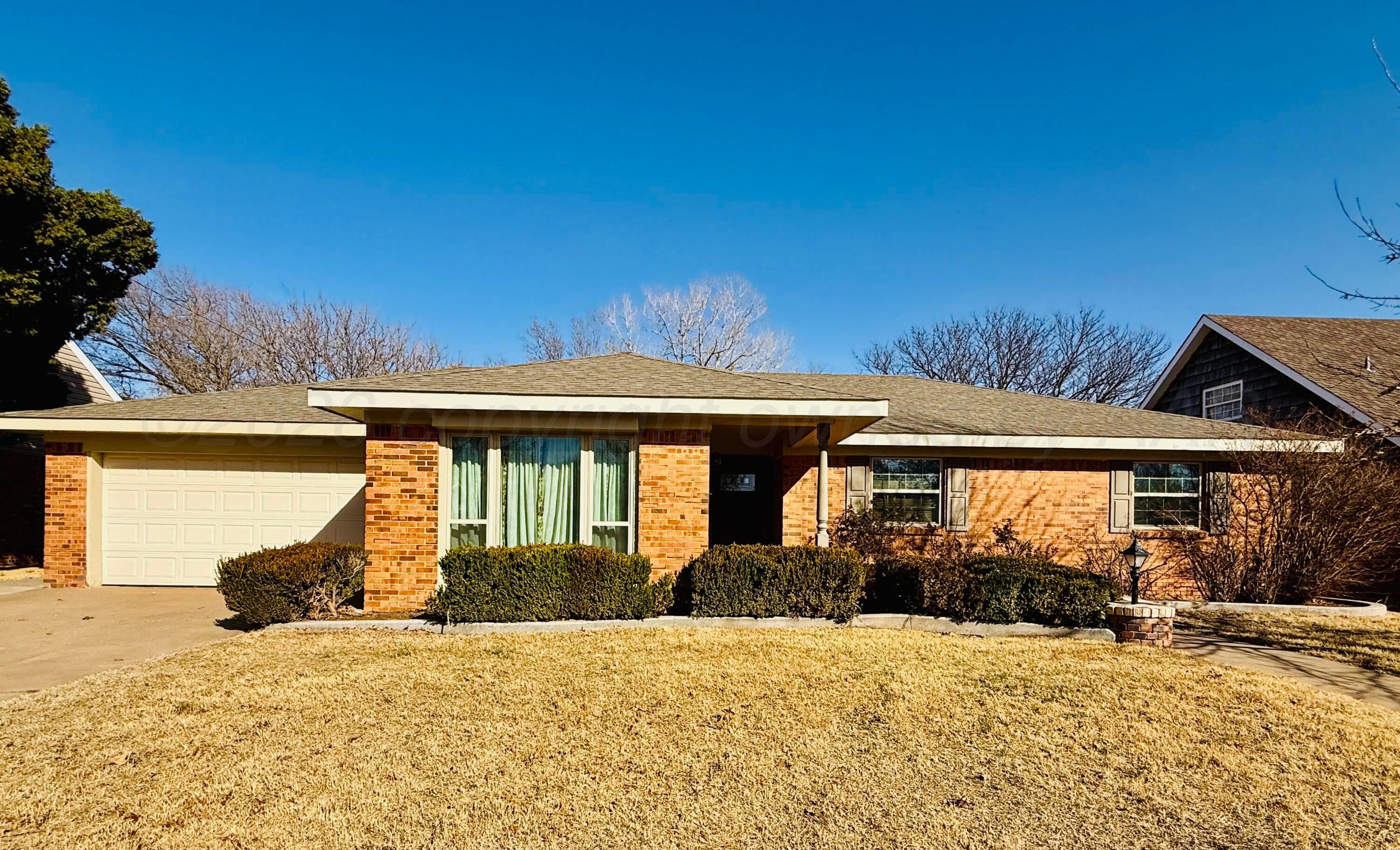 1509 Pellinore Street Borger, TX 79007 - Photo 1 of 22 a front view of a house with a yard