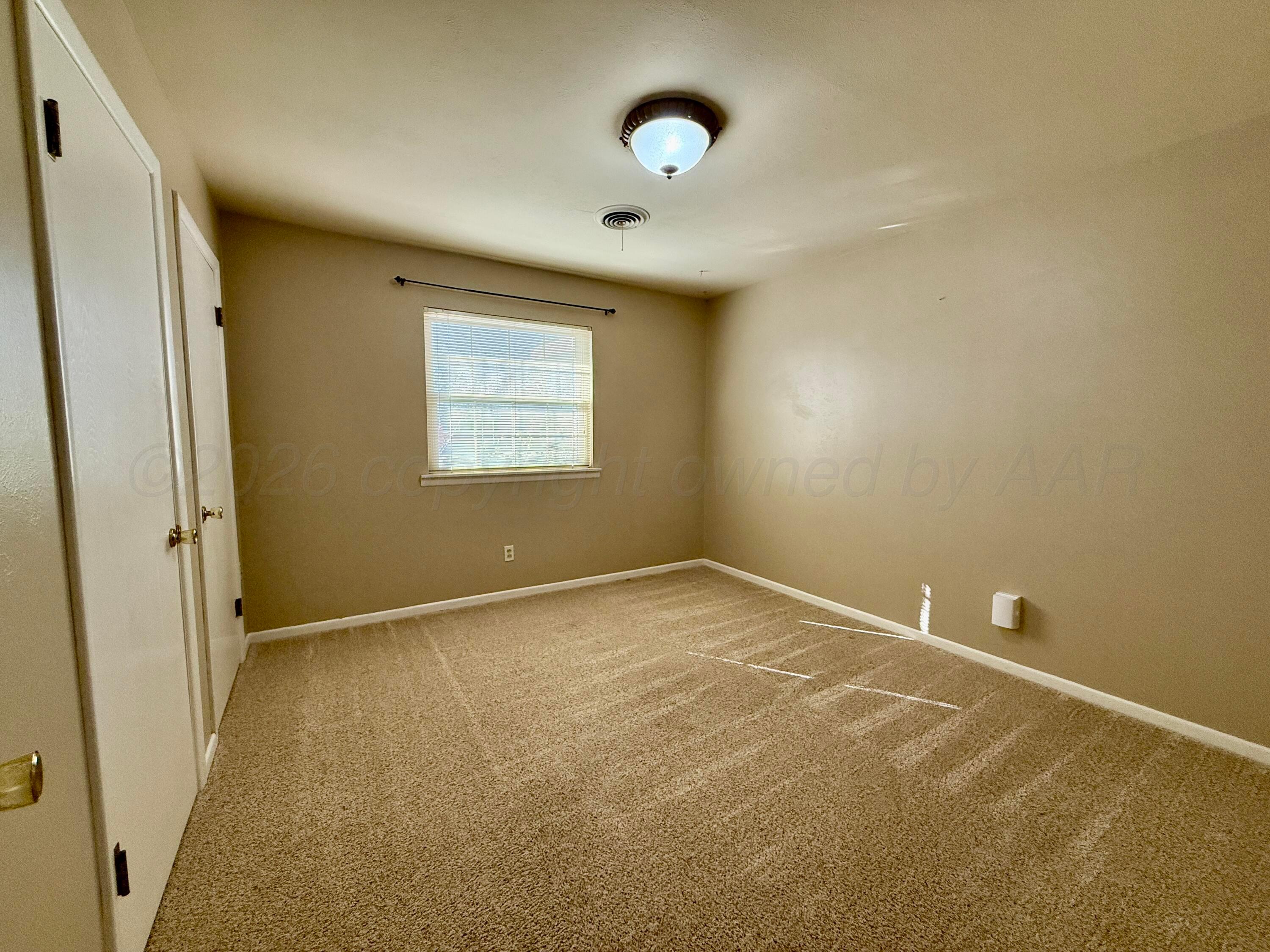 1509 Pellinore Street Borger, TX 79007 - Photo 14 of 22 an empty room with a window