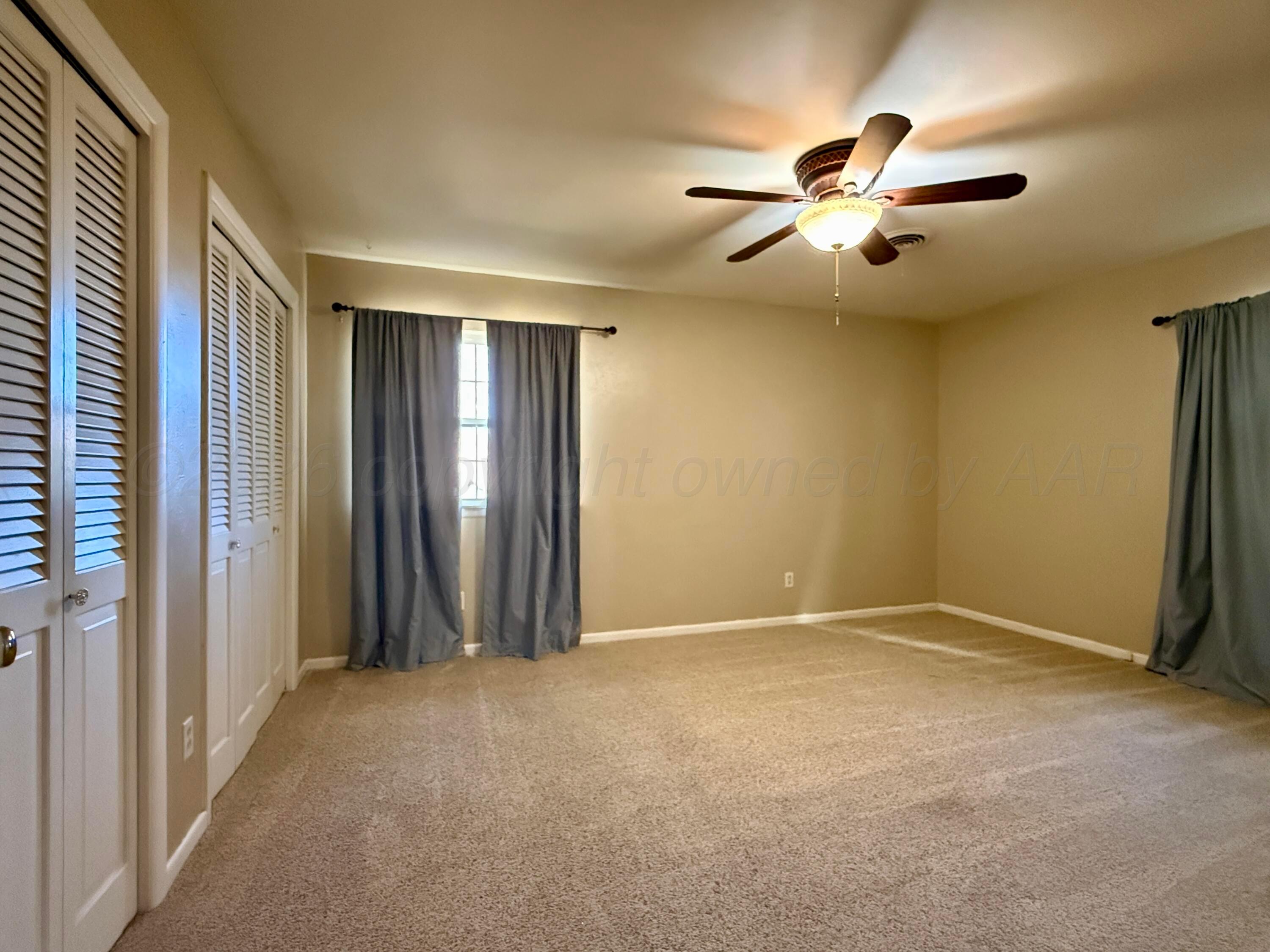 1509 Pellinore Street Borger, TX 79007 - Photo 20 of 22 a view of an empty room with a ceiling fan