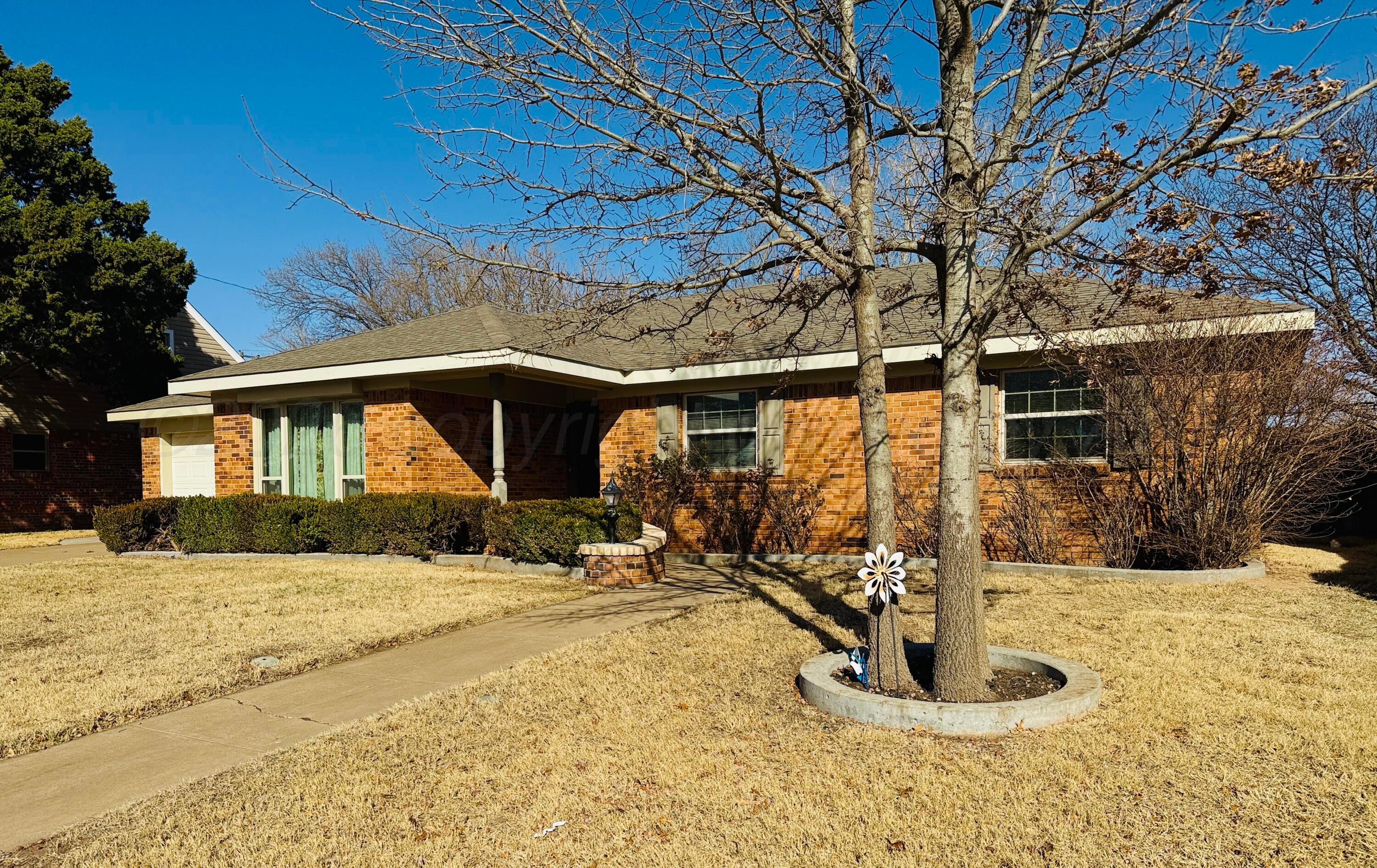 1509 Pellinore Street Borger, TX 79007 - Photo 2 of 22 a view of a house with snow on the road