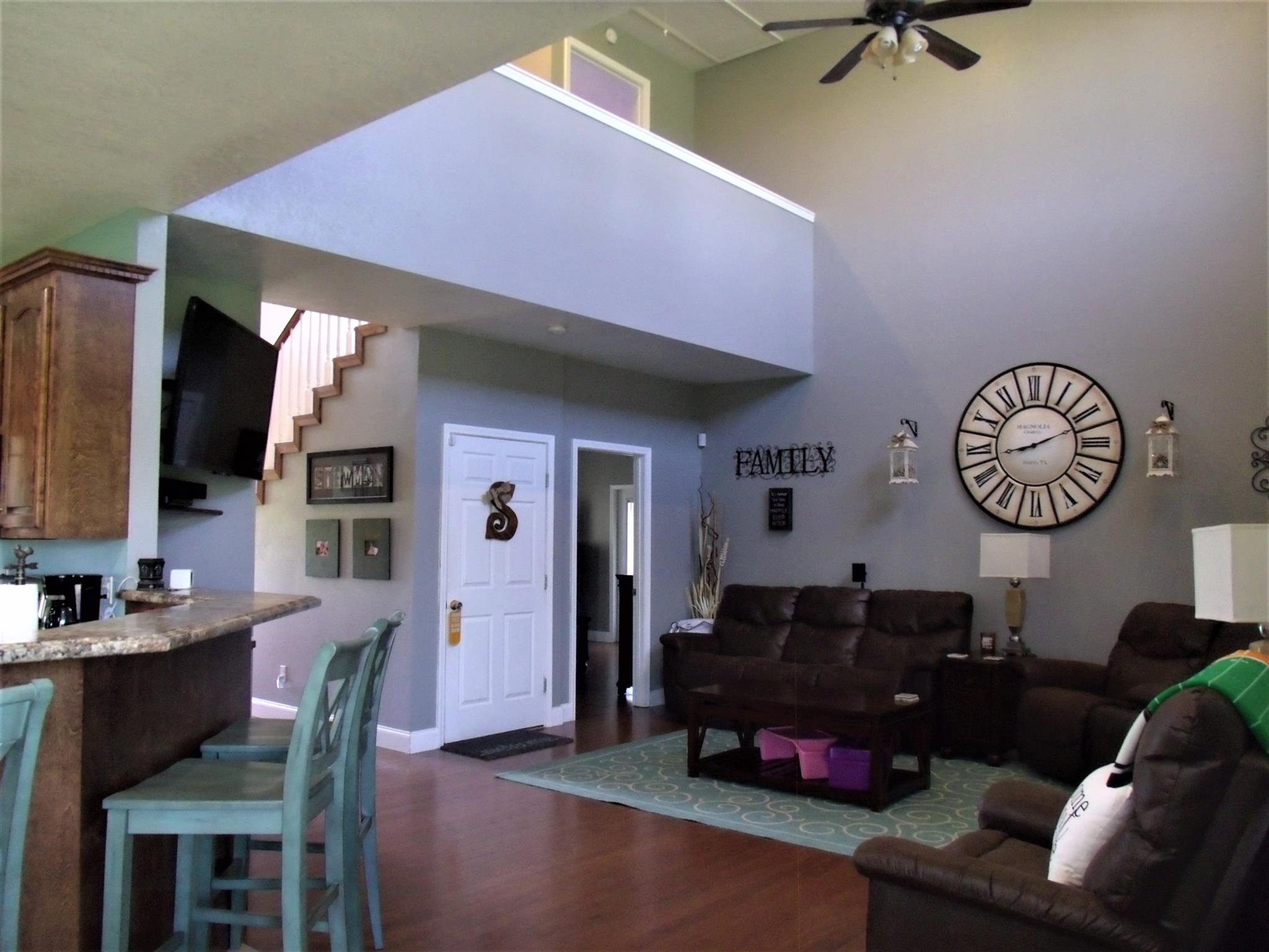3550 Williams Cove Road Winchester, TN 37398 - Photo 5 of 26 a living room with furniture a flat screen tv and kitchen view