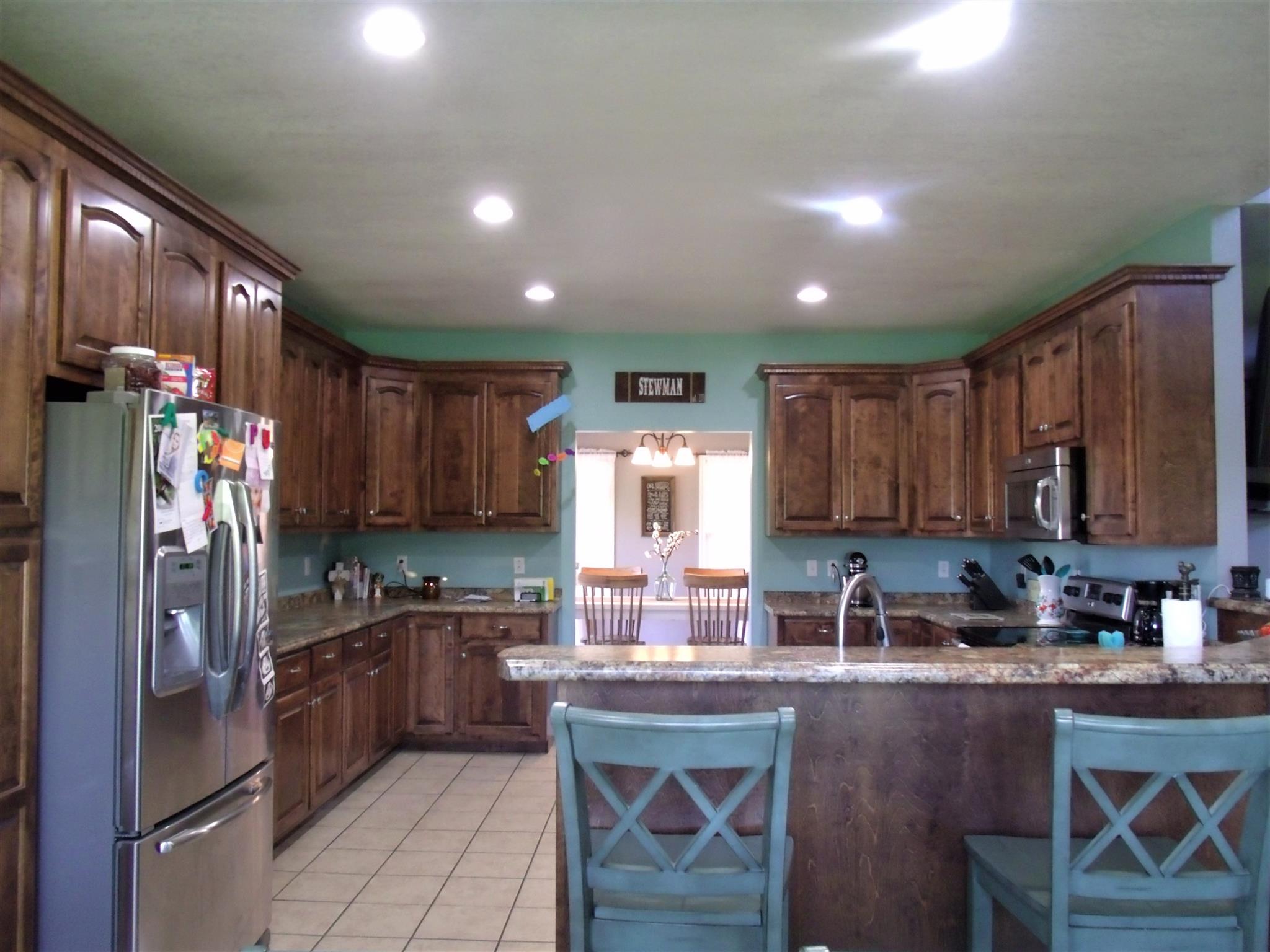 3550 Williams Cove Road Winchester, TN 37398 - Photo 8 of 26 a kitchen with granite countertop a refrigerator stove top oven and sink