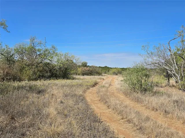a view of lake with green space