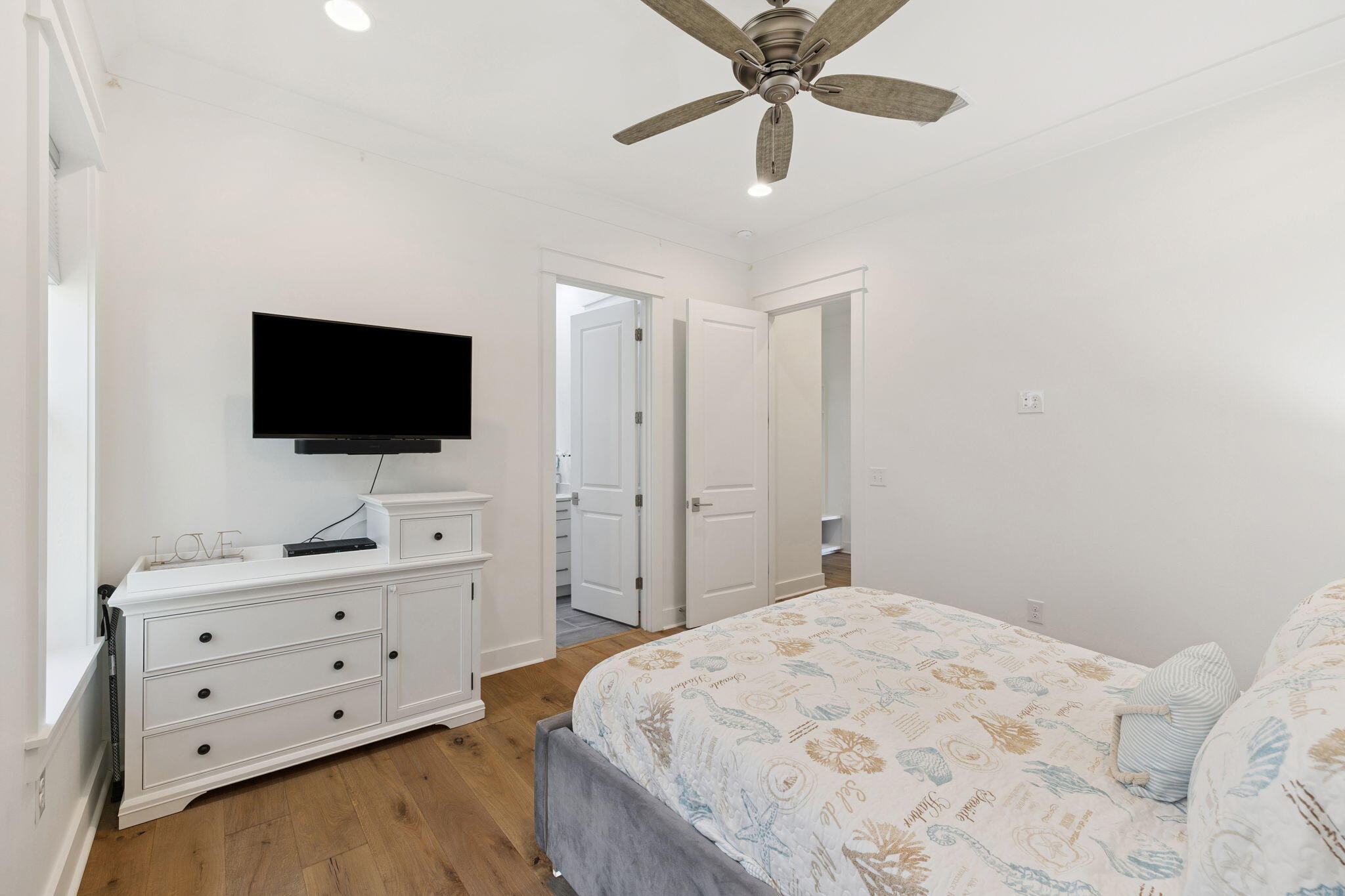 184 Trailhead Drive Inlet Beach, FL 32461 - Photo 30 of 49 a bedroom with a bed and a flat tv screen on dresser