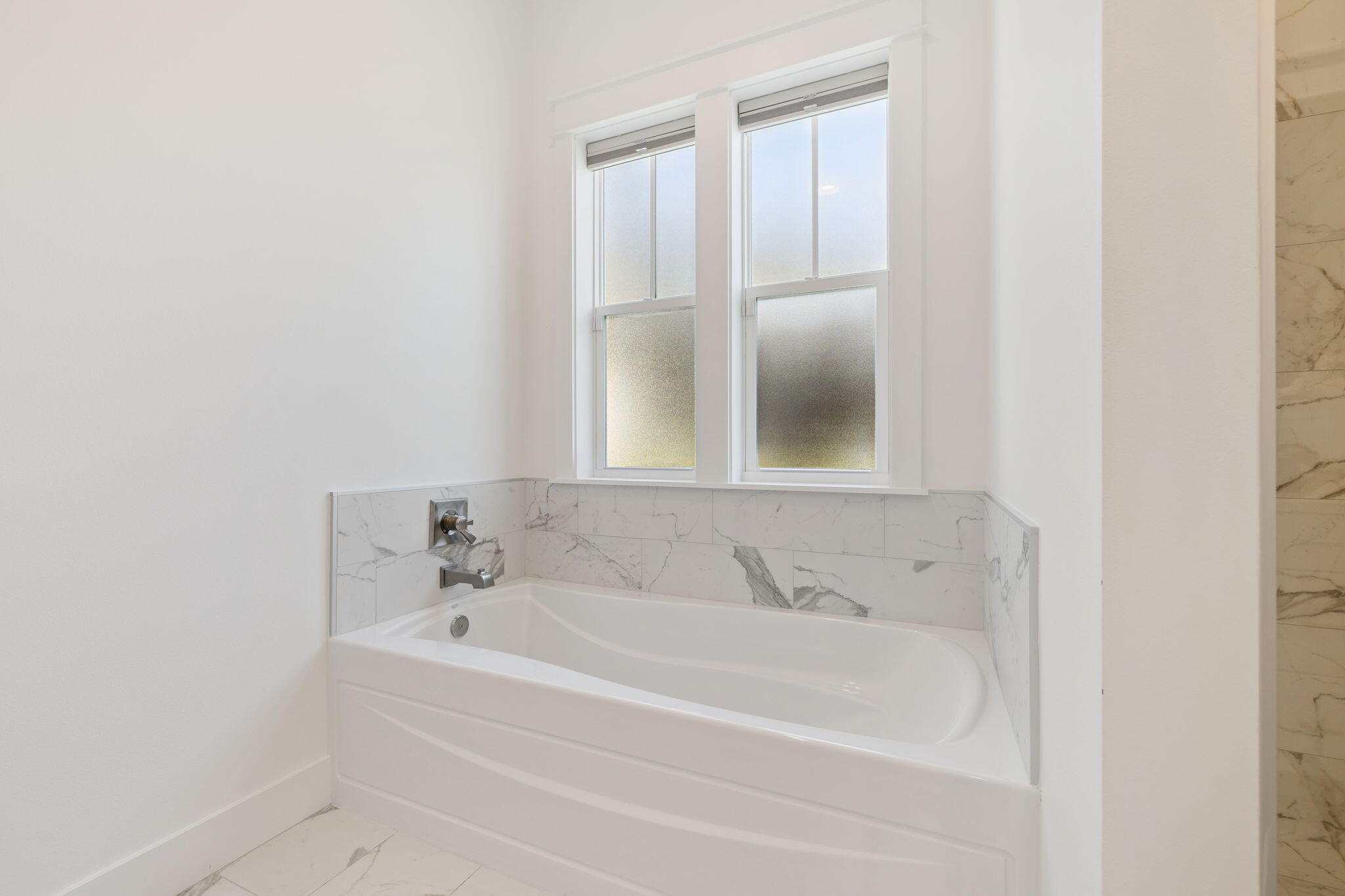 184 Trailhead Drive Inlet Beach, FL 32461 - Photo 41 of 49 a white bath tub sitting next to a window