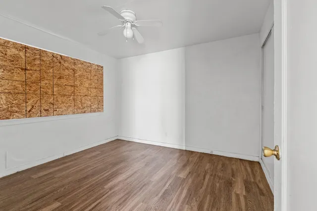 a bathroom with a granite countertop toilet a sink and a shower