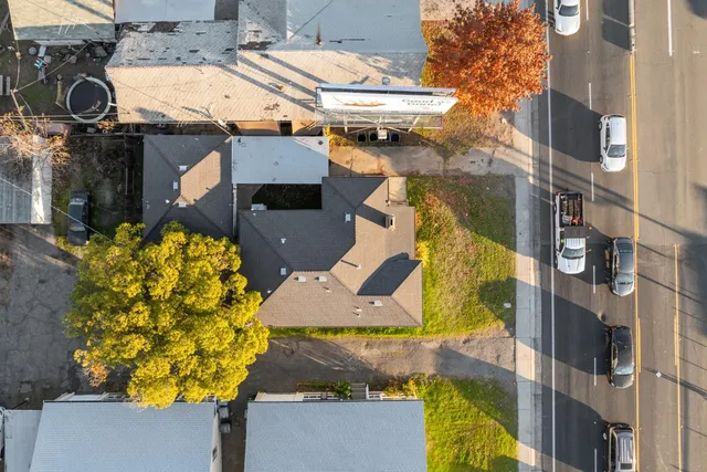 an aerial view of residential houses with outdoor space