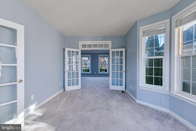 an empty room with windows