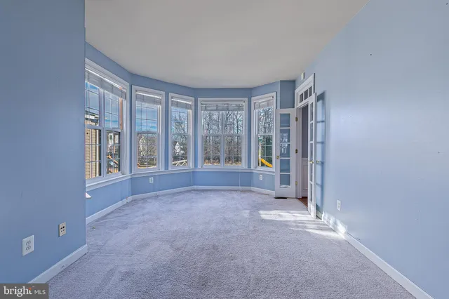 a kitchen with stainless steel appliances granite countertop wooden floors and view living room