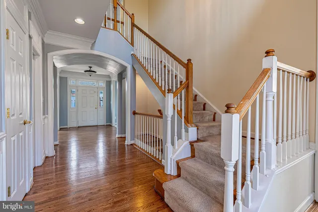 a spacious bathroom with a tub sink and mirror