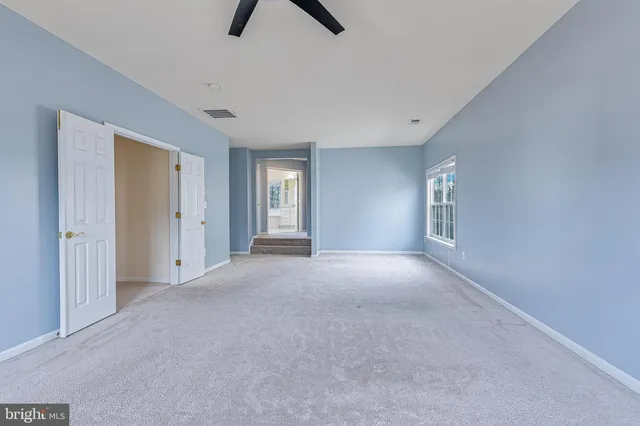 a spacious bathroom with sink shower and bathtub