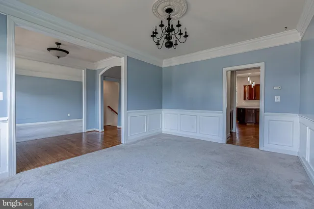 a view of empty room with a fireplace and entryway