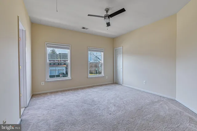 a bathroom with a sink a toilet a mirror and shower