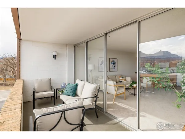 a balcony and view of living room