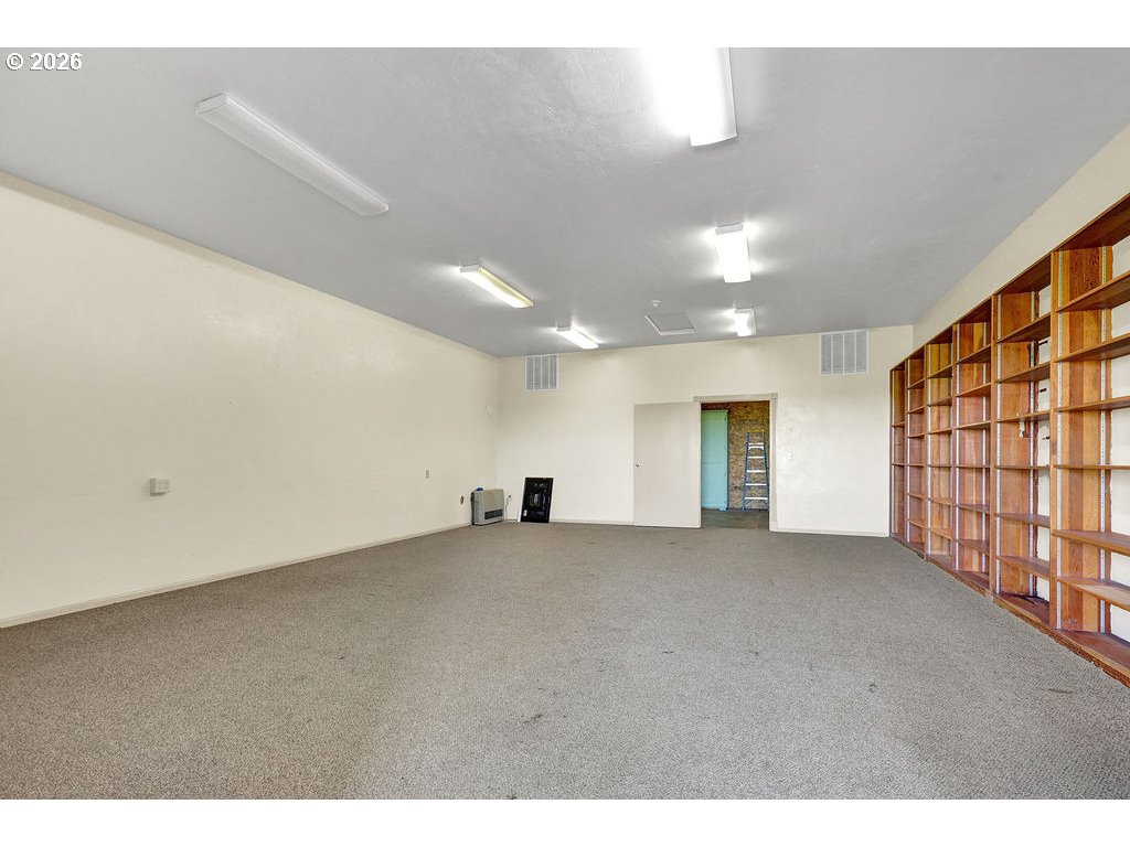 21211 Coburg Road Harrisburg, OR 97446 - Photo 43 of 48 a view of an empty room with wooden floor