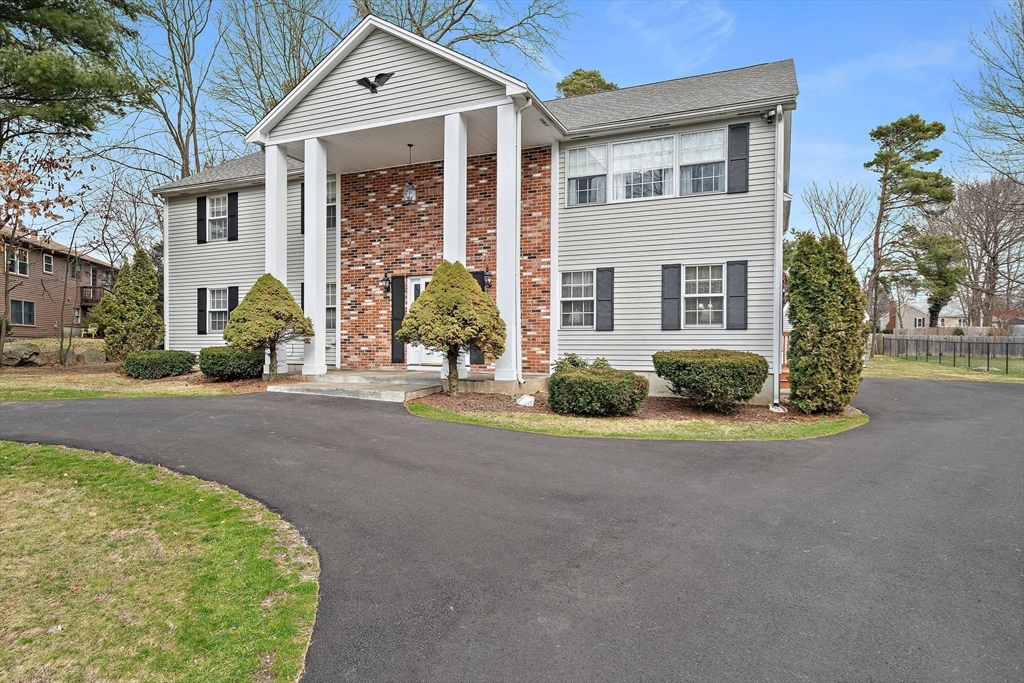 38 Roosevelt Street, Unit 2 Braintree, MA 02184 - Photo 3 of 17 a front view of a house with a garden