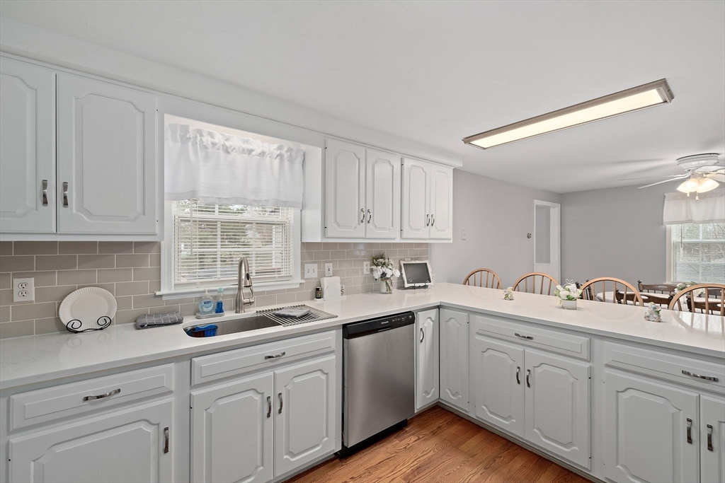 38 Roosevelt Street, Unit 2 Braintree, MA 02184 - Photo 5 of 17 a kitchen with cabinets appliances a sink and a window