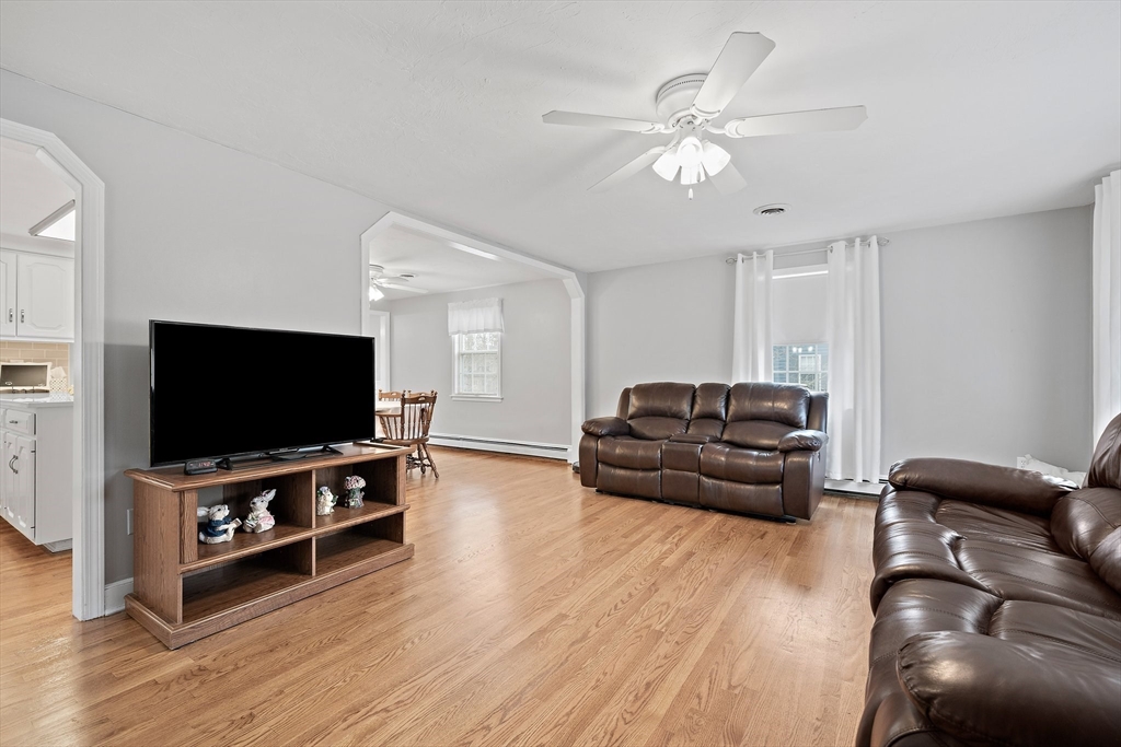 38 Roosevelt Street, Unit 2 Braintree, MA 02184 - Photo 8 of 17 a living room with furniture and a flat screen tv