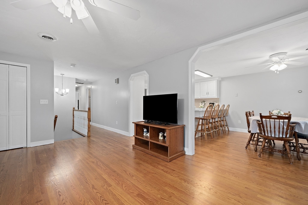 38 Roosevelt Street, Unit 2 Braintree, MA 02184 - Photo 9 of 17 a living room with furniture wooden floor and a flat screen tv
