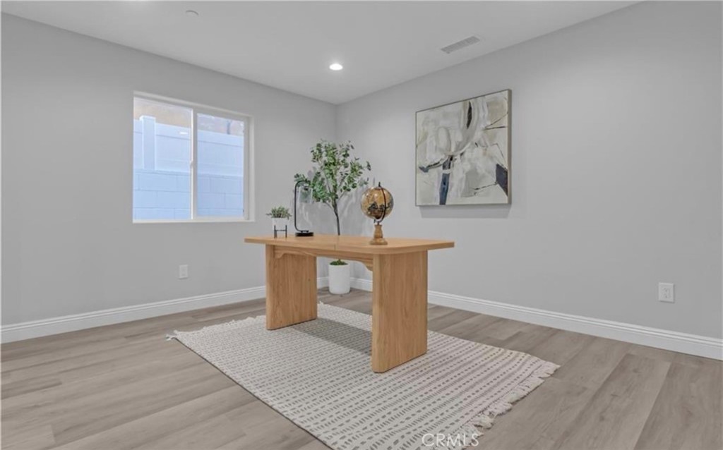 22022 Pioneer Boulevard Hawaiian Gardens, CA 90716 - Photo 13 of 50 a workspace with wooden floor