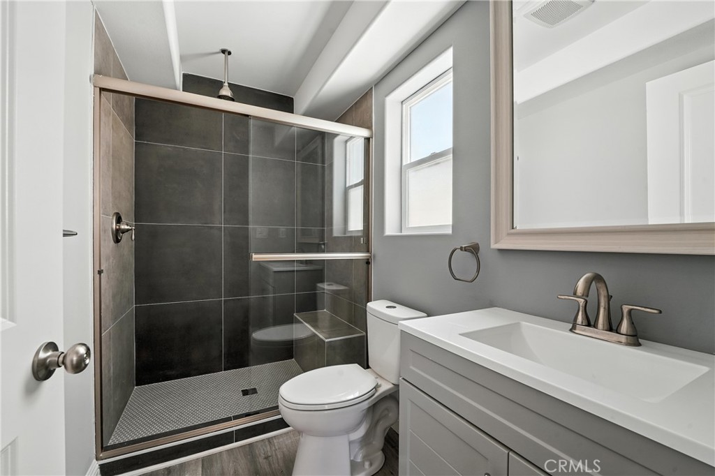 22022 Pioneer Boulevard Hawaiian Gardens, CA 90716 - Photo 14 of 50 a bathroom with a sink toilet and shower