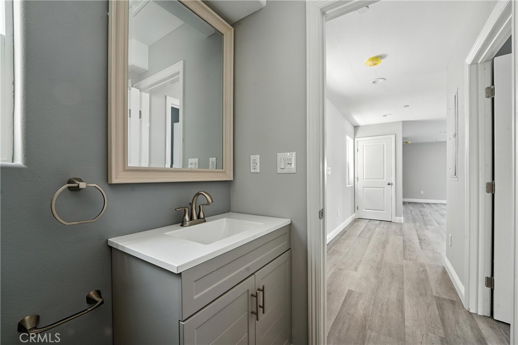 22022 Pioneer Boulevard Hawaiian Gardens, CA 90716 - Photo 15 of 50 a bathroom with a sink and a mirror