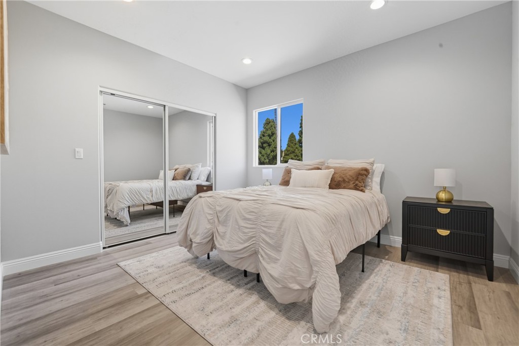 22022 Pioneer Boulevard Hawaiian Gardens, CA 90716 - Photo 22 of 50 a bedroom with a bed and window