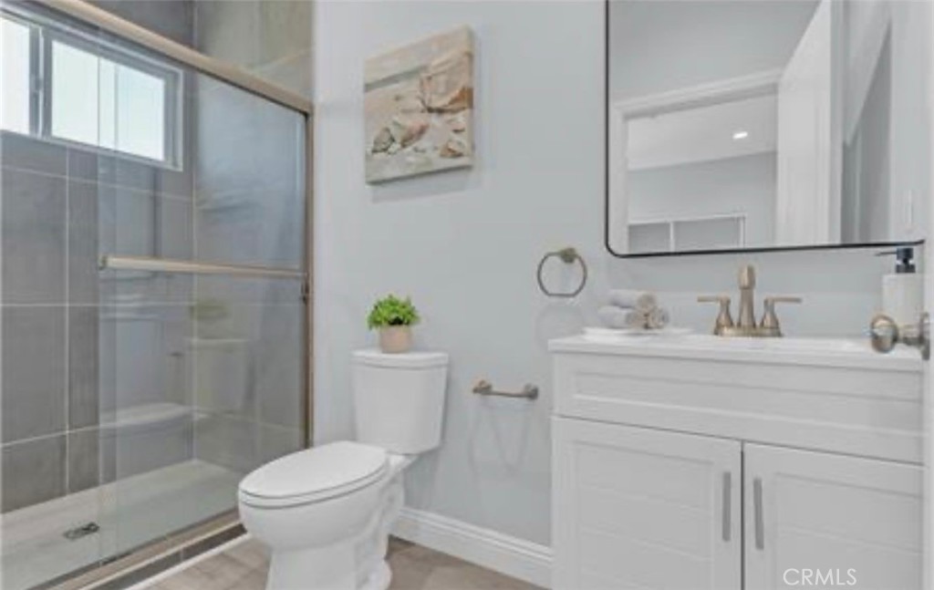 22022 Pioneer Boulevard Hawaiian Gardens, CA 90716 - Photo 23 of 50 a bathroom with a sink toilet and shower