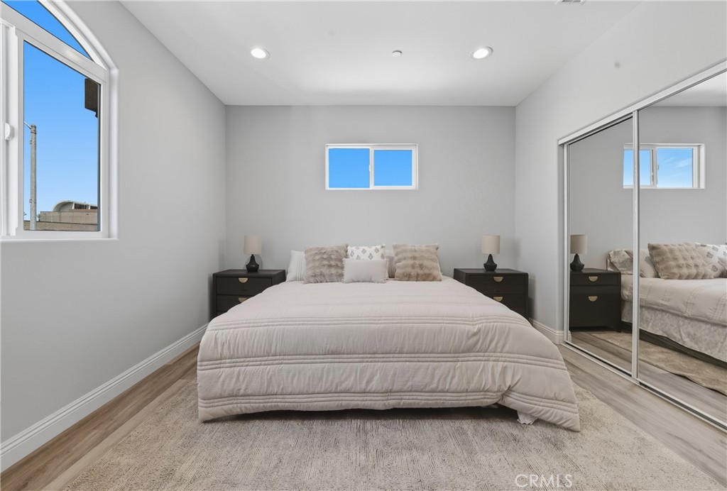 22022 Pioneer Boulevard Hawaiian Gardens, CA 90716 - Photo 29 of 50 a bedroom with a bed and a large window