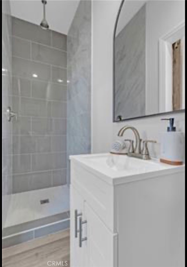 22022 Pioneer Boulevard Hawaiian Gardens, CA 90716 - Photo 30 of 50 a bathroom with a sink and a mirror