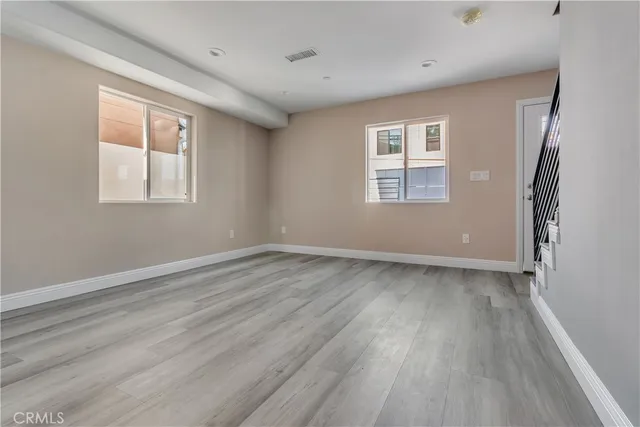 a kitchen with cabinets appliances a sink and a window