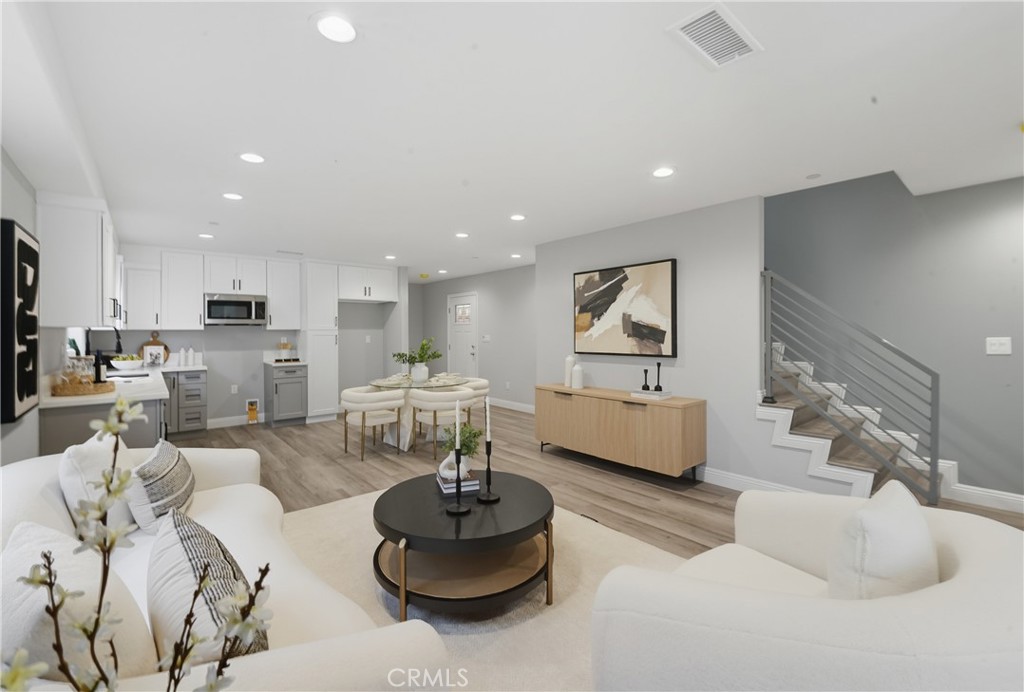22022 Pioneer Boulevard Hawaiian Gardens, CA 90716 - Photo 3 of 50 a living room with furniture and a view of kitchen