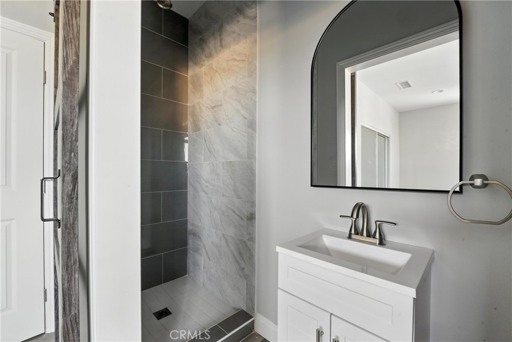 22022 Pioneer Boulevard Hawaiian Gardens, CA 90716 - Photo 31 of 50 a bathroom with a sink and mirror