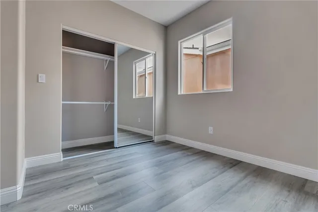 an empty room with wooden floor