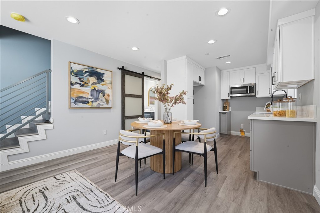 22022 Pioneer Boulevard Hawaiian Gardens, CA 90716 - Photo 37 of 50 a view of a dining room with furniture a rug and wooden floor
