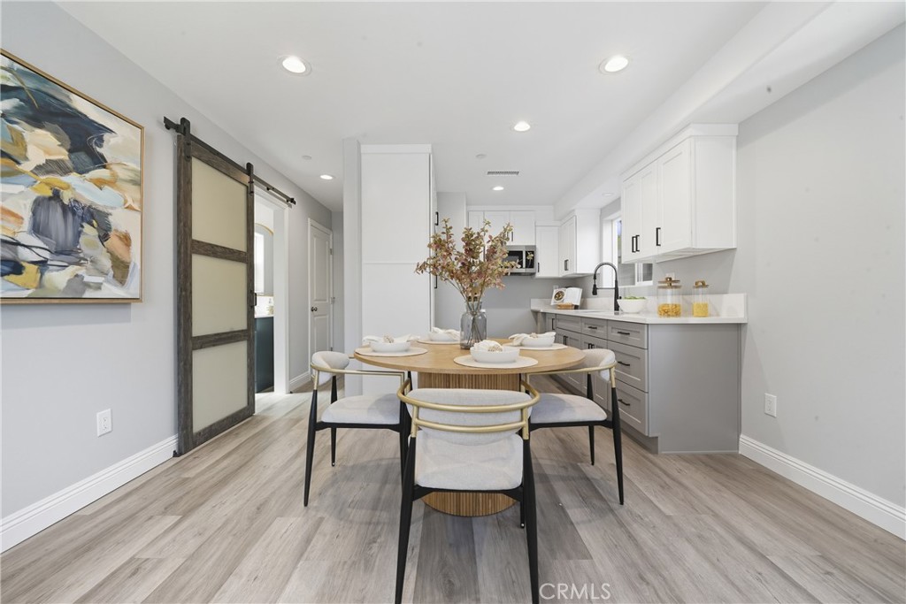 22022 Pioneer Boulevard Hawaiian Gardens, CA 90716 - Photo 39 of 50 a view of a dining room with furniture and wooden floor