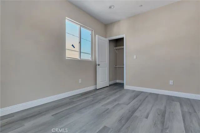a white toilet sitting next to a window
