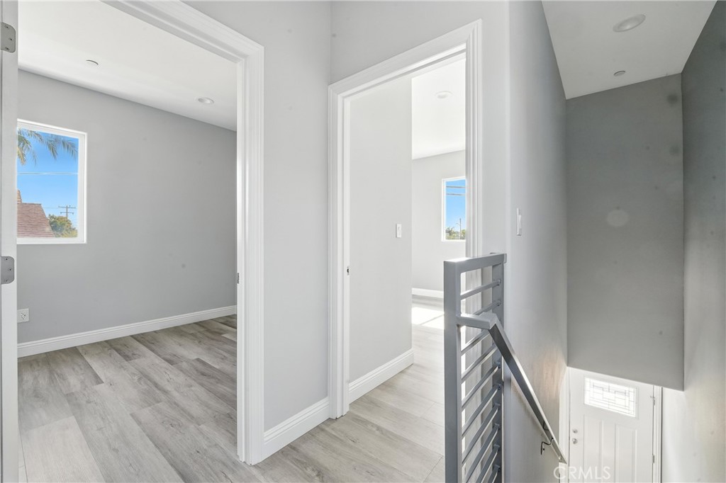 22022 Pioneer Boulevard Hawaiian Gardens, CA 90716 - Photo 48 of 50 a view of a hallway with wooden floor and staircase