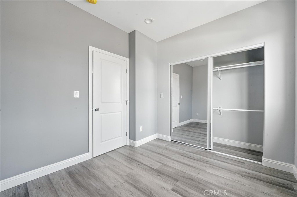 22022 Pioneer Boulevard Hawaiian Gardens, CA 90716 - Photo 49 of 50 a view of an empty room with wooden floor and closet