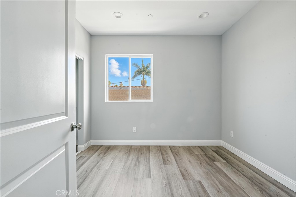 22022 Pioneer Boulevard Hawaiian Gardens, CA 90716 - Photo 50 of 50 a view of an empty room with wooden floor and a window