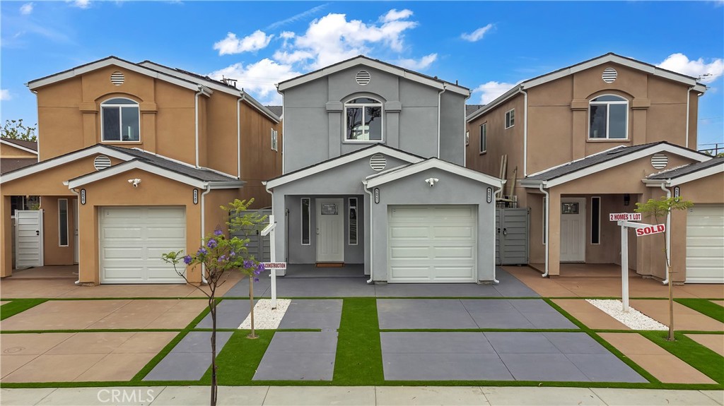 22022 Pioneer Boulevard Hawaiian Gardens, CA 90716 - Photo 6 of 50 a front view of a house with a yard and garage