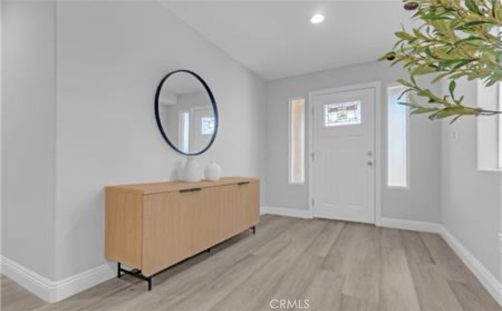 22022 Pioneer Boulevard Hawaiian Gardens, CA 90716 - Photo 8 of 50 a view of a room with wooden floor and a potted plant