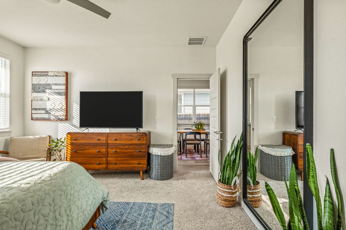 10002 Baden Lane Austin, TX 78754 - Photo 13 of 28 Carpeted bedroom with ceiling fan