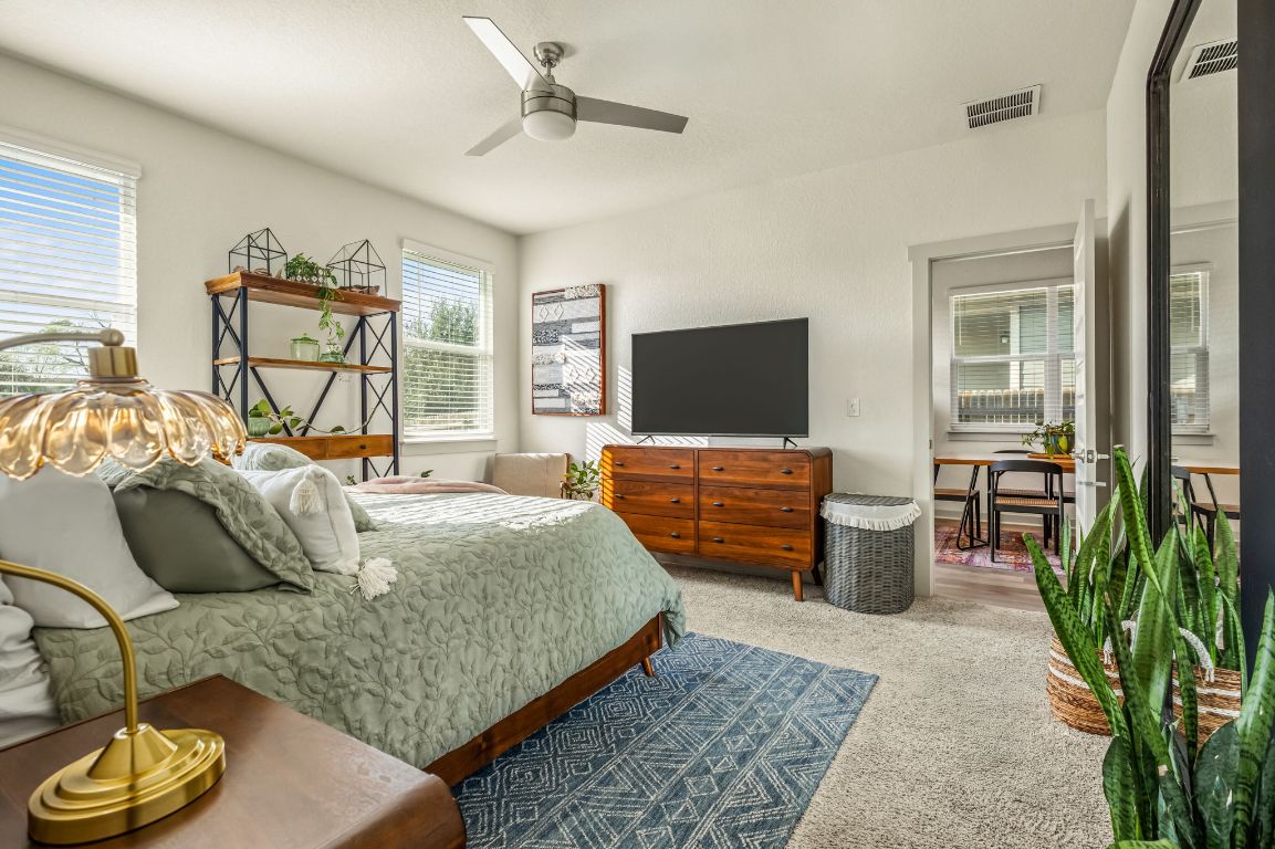 10002 Baden Lane Austin, TX 78754 - Photo 14 of 28 Bedroom with carpet flooring and ceiling fan