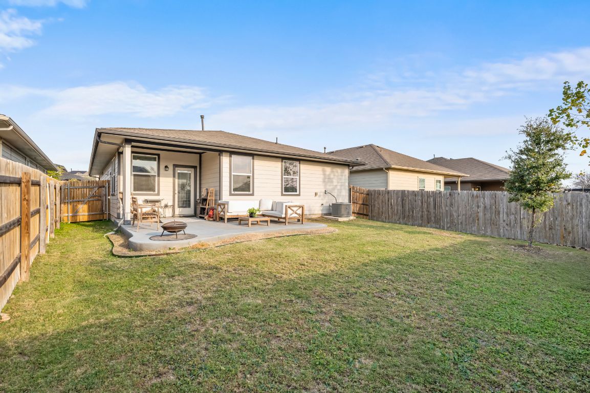 10002 Baden Lane Austin, TX 78754 - Photo 24 of 28 Back of house with a fenced backyard and a patio