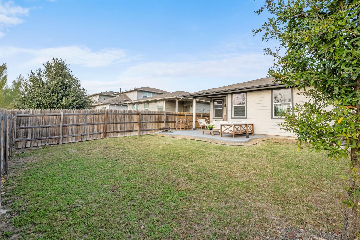 10002 Baden Lane Austin, TX 78754 - Photo 26 of 28 Back of property featuring a patio area and a fenced backyard