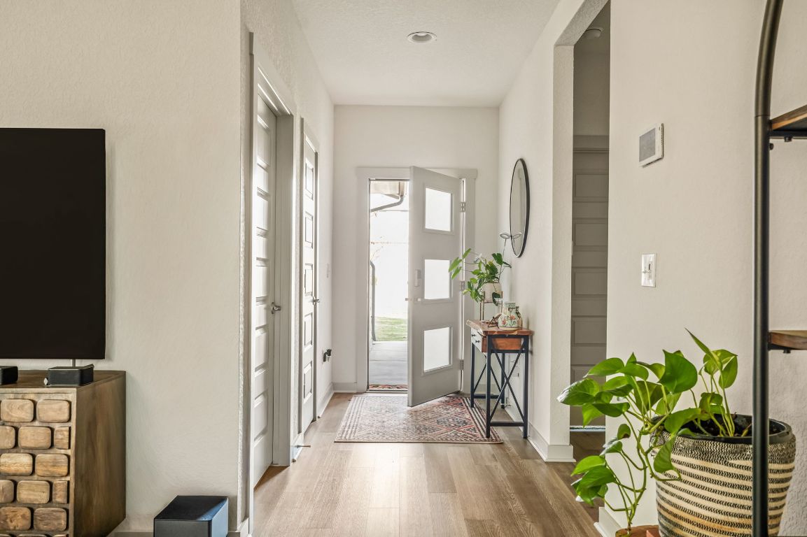 10002 Baden Lane Austin, TX 78754 - Photo 3 of 28 Foyer with light wood-type flooring and baseboards