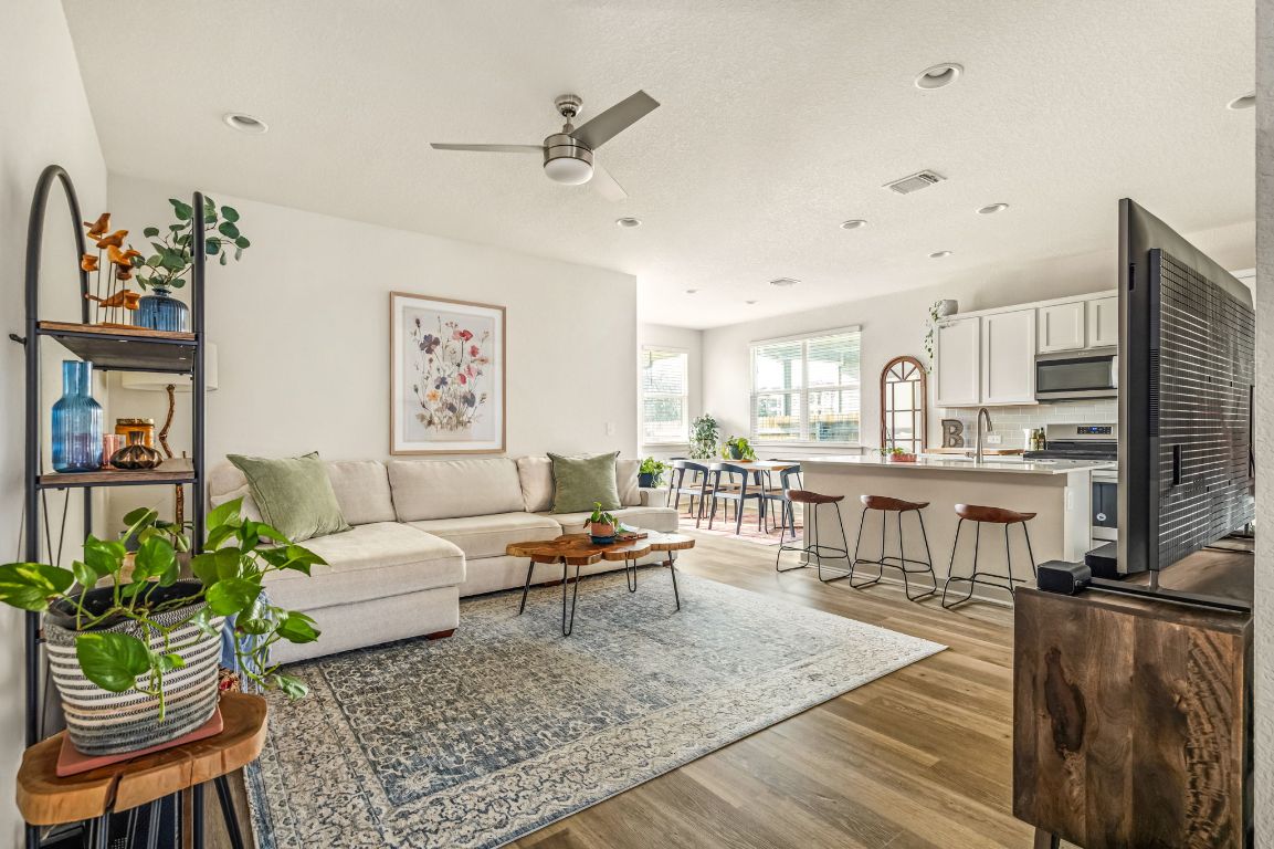 10002 Baden Lane Austin, TX 78754 - Photo 4 of 28 Living room featuring light wood-style flooring and ceiling fan