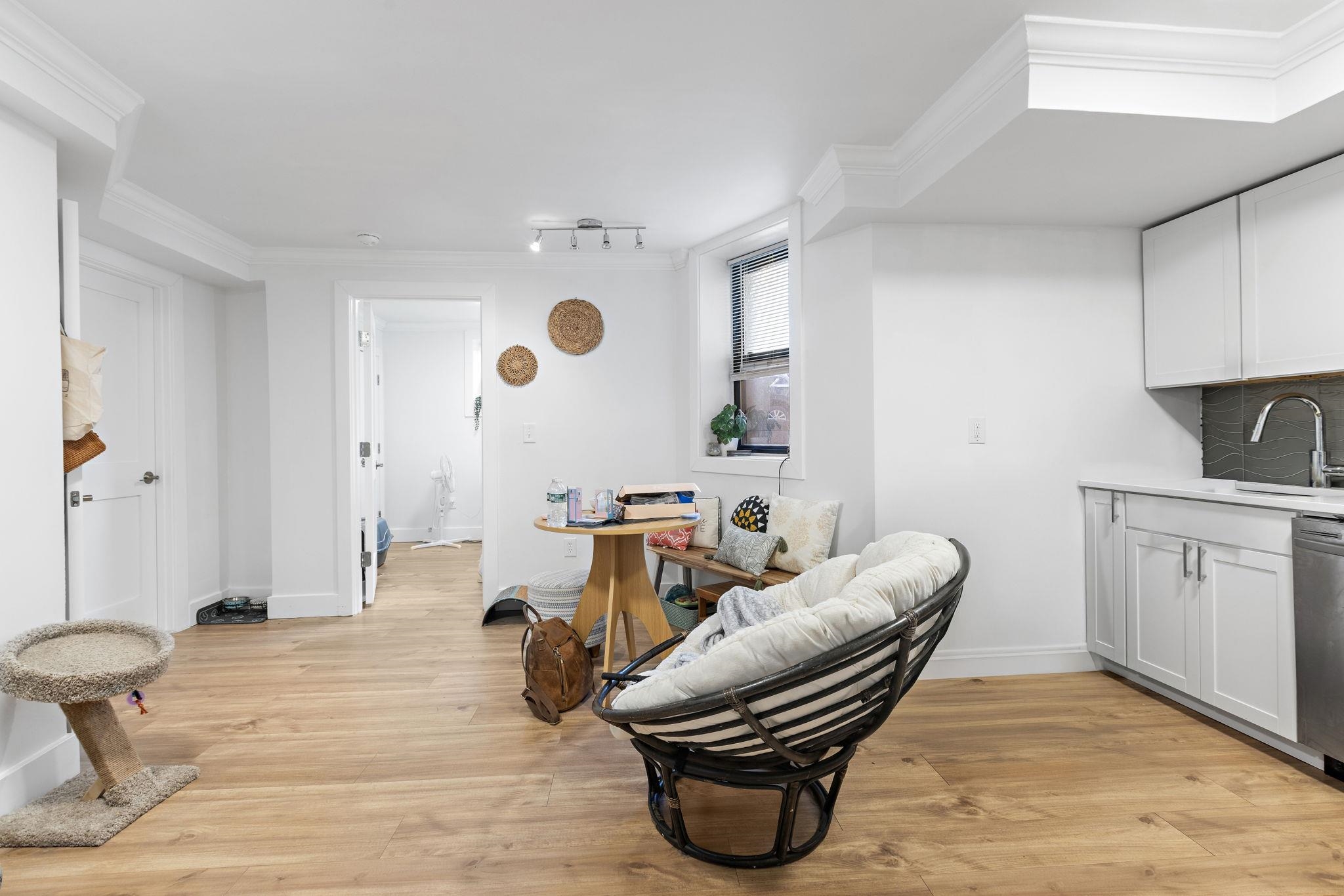151 Sip Avenue, Unit 38 Jersey City, NJ 07306 - Photo 2 of 12 a living room with furniture and a wooden floor