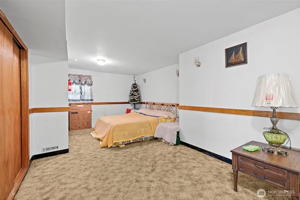 a bedroom with a bed and a dresser